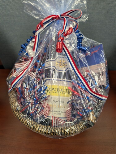 Prize basket with wine bottle and gift card