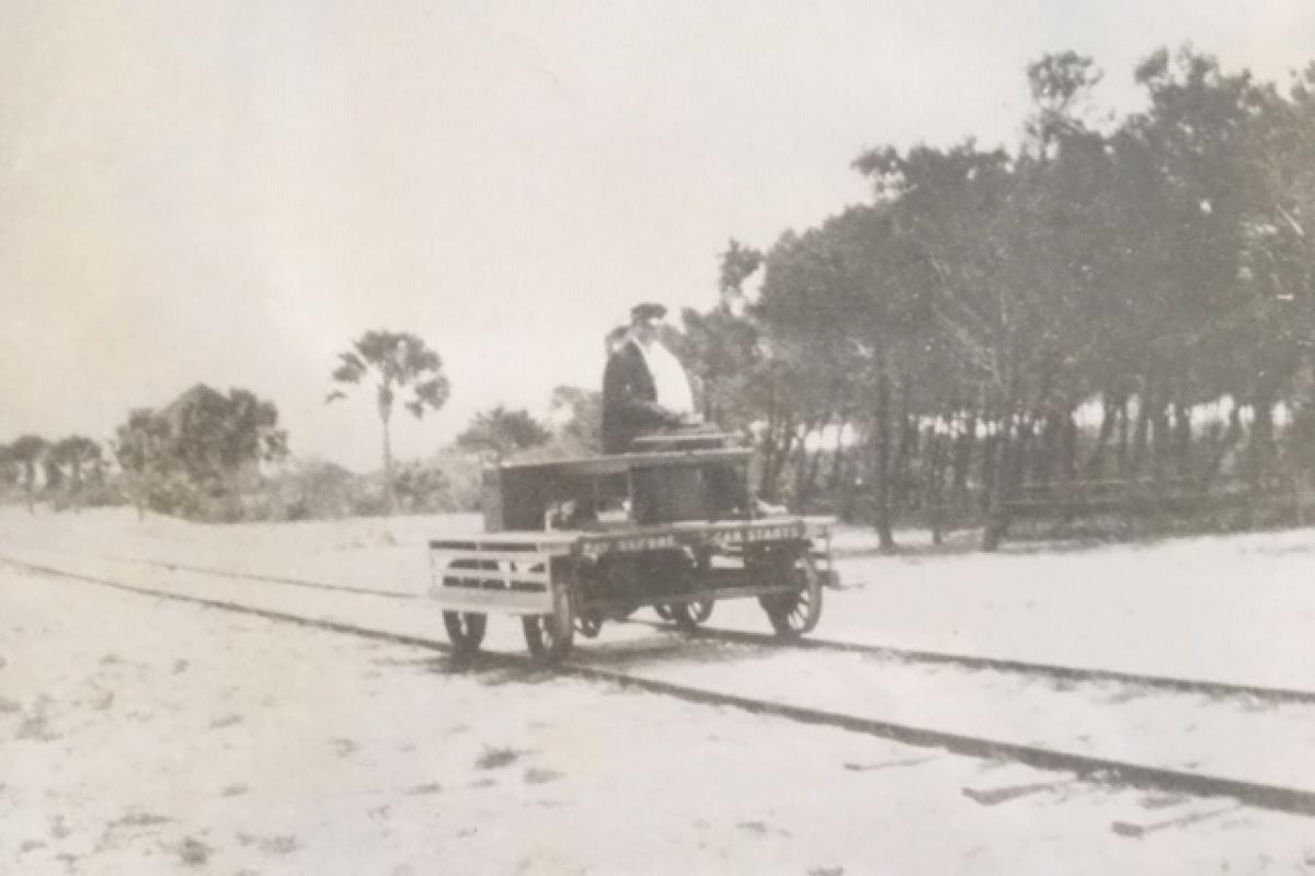 historical photo of a cart on train tracks